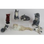 Four Royal Copenhagen porcelain cats, a Royal Copenhagen figure of pigs, a Nao figure of a Persian