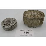 Two small white metal filigree boxes with hinged lids, one approx 2" x 1 1/2". Condition report: