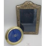 A silver circular photograph frame with bead edge design, approx 4" across, (as new and boxed). A