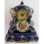 An English Strasburg Ware pottery mantel clock and stand with French movement. Overall height