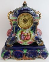 An English Strasburg Ware pottery mantel clock and stand with French movement. Overall height