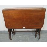 An Edwardian mahogany Sutherland table, on tapering square supports with ceramic castors.