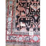 Nahawand carpet, central patterned field depicting styalised animals on black ground. 3.15 x 1.62cm.