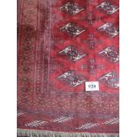 A Turkoman carpet, central repeat pattern on claret ground. 3.40 x 2.40. Condition report: Excellent
