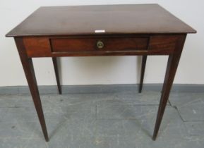 A Regency mahogany rectangular side table, with single drawer with pressed brass handle, on tapering
