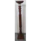 A Victorian mahogany torchere, with carved and fluted column, on a stepped plinth base. Condition