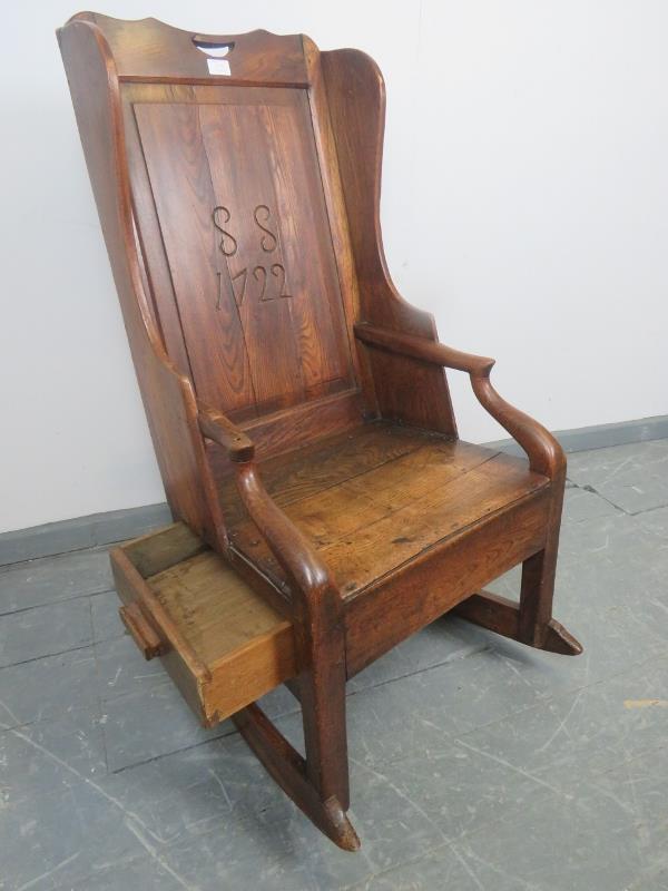 An 18th century fruitwood lambing chair, the panelled back carved with ‘SS 1722’, featuring under - Image 3 of 5