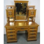 An Edwardian walnut dressing table, the gallery with adjustable mirror flanked by two small