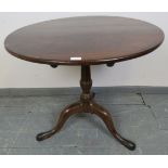 A George III ‘birdcage’ tilt-top table, the oak top on a mahogany tapering column with outswept