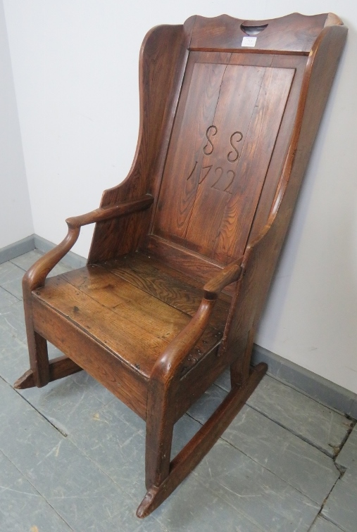 An 18th century fruitwood lambing chair, the panelled back carved with ‘SS 1722’, featuring under - Image 2 of 5