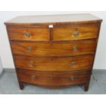 A Regency Period mahogany bow fronted chest of two short over three long graduated cock-beaded