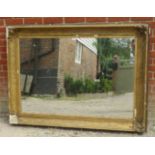 A large 19th century rectangular wall mirror in an ornate gilt gesso frame with acanthus and shell