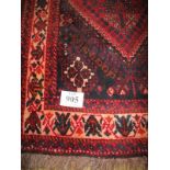 A 20th century Persian wool rug runner hand knotted, with central diamond motif - white on claret