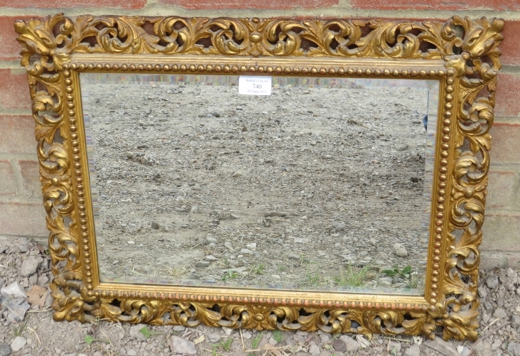 A 19th century rectangular Florentine mirror, the gilt frame with beaded edging and pierced acanthus