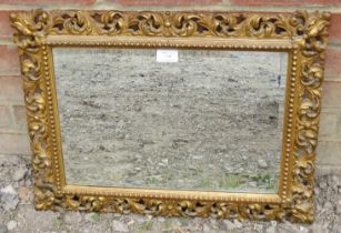 A 19th century rectangular Florentine mirror, the gilt frame with beaded edging and pierced acanthus