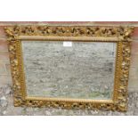 A 19th century rectangular Florentine mirror, the gilt frame with beaded edging and pierced acanthus