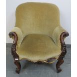 A 19th century mahogany framed parlour chair, with acanthus carved and scrolled arms, upholstered in