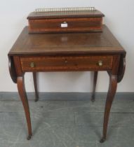 An Edwardian mahogany kidney-shaped drop-leaf writing table, inlaid and crossbanded, with raised