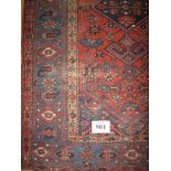 An early 20th century Persian rug on central motif on terracotta field. 200cm x 136cm (approx).