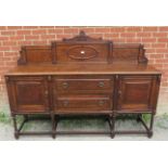 A turn of the century oak sideboard c.1900, with rear gallery carved with Greek key motifs, over two