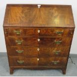 A Georgian flame mahogany bureau, inlaid and crossbanded, the fall front opening onto a fitted