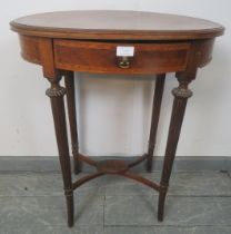 An Edwardian mahogany and walnut oval occasional table, crossbanded and inlaid with satinwood and