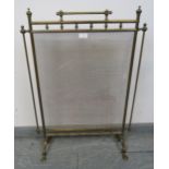 An Edwardian brass and mesh freestanding fire guard with finials, on splayed supports. Condition