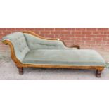 A 19th century show-wood chaise longue, upholstered in pale green buttoned velvet type material with