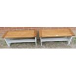 A pair of light oak benches, on stile supports painted white with middle stretcher. Condition