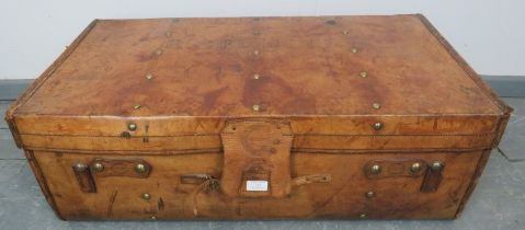 A large antique leather travelling trunk by Drew & Sons of Piccadilly of excellent patina, with