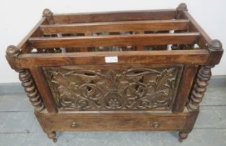 A turn of the century Anglo-Indian hardwood Canterbury, with foliate carved and pierced sides,