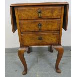 An antique burr walnut side cabinet, crossbanded and strung with boxwood and satinwood, with drop