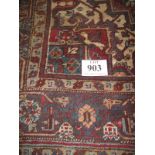 A mid 20th century Persian carpet, central motif on a claret field. 189cm x 273cm. Condition report: