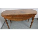 A Georgian mahogany oval Pembroke table, the single drawer with brass lock escutcheon and swan