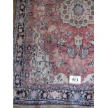 A Bidjar rug, central pattern on cream/pink field with blue borders. 165cm x 125cm. Condition