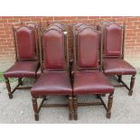 A set of 10 early 20th century period style solid oak dining chairs, upholstered in distressed brown