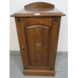 An Edwardian mahogany bedside cabinet with painted decoration in the Neo-Classical taste and