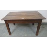 An 18th century oak country made rectangular coffee table, on tapering square inner-chamfered