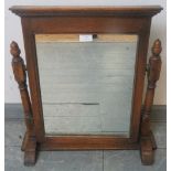 A vintage oak swing vanity mirror in the 18th century taste, with carved cornice and turned and