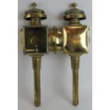 A good quality pair of 19th century brass carriage lamps with oil burners, bevelled glass sides