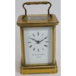 A brass cased 8 day carriage clock by Matthew Norman. Eleven jewel Swiss movement. Height 14.5cm.
