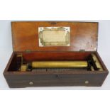 An antique Swiss music box with brass and steel mechanism in an inlaid rosewood veneer case. 45cm