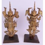 A pair of gilt wood and metal Asian dancers, mounted on hardwood pedestals. Height 40cm. (pr).