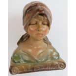 An early 20th century Art Nouveau plaster bust of a young girl numbered 232 to reverse. Height 33cm.