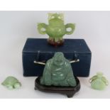 A Chinese carved nephrite jade lidded censer and box, a carved greenstone Buddha on stand, a