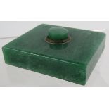An Art Deco green jade servant's bell push with brass mounts. 5cm x 45cm. Condition report: Small