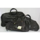 A set of three Gucci graduated travel holdalls in black buttersoft leather with stitched horse bit