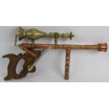 A Bespoke hand made steam punk ray gun constructed from copper and brass with a wooden saw stock.