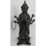 An antique Chinese bronze figure of a Deity, probably the Buddhist Goddess Marici, with Chinese