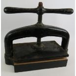 A vintage cast iron book press with manual turn screw. 50cm x 25cm. Condition report: Vintage